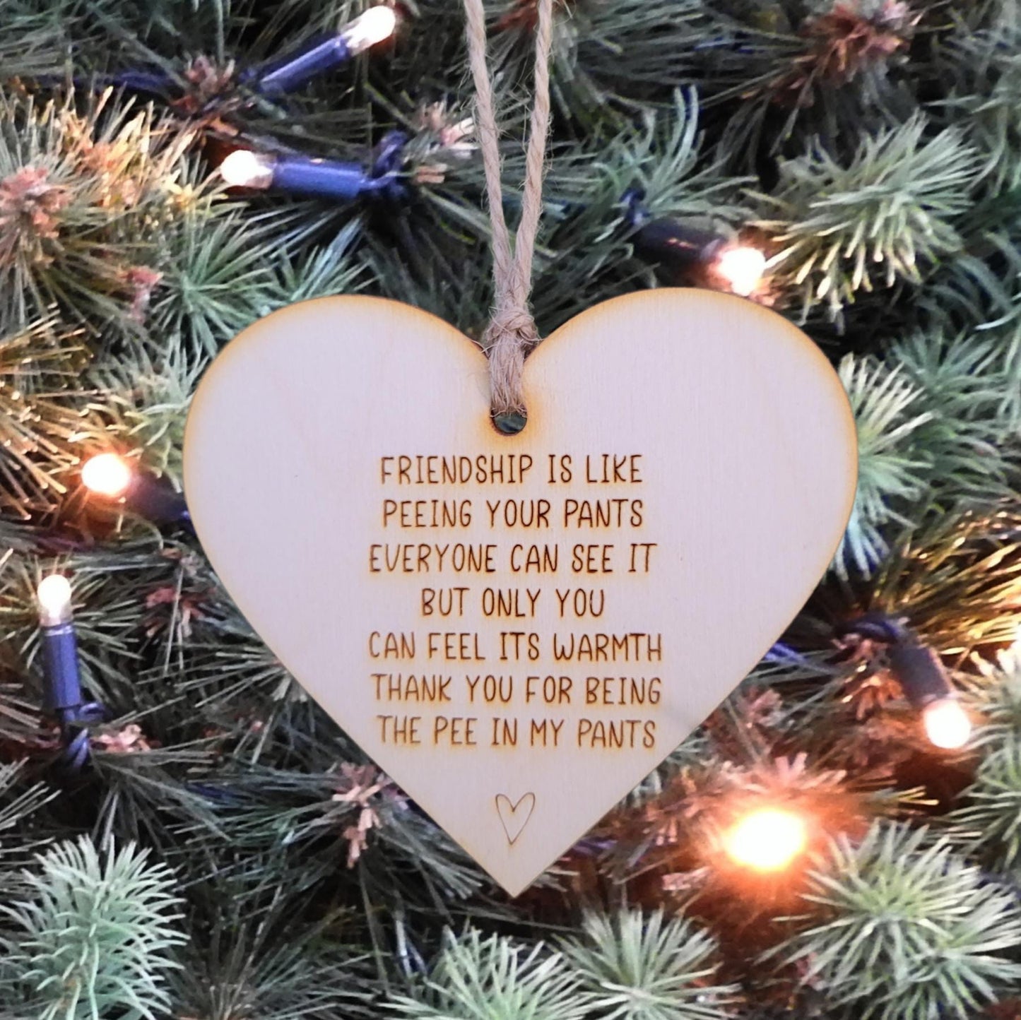 Simple rustic heart ornaments that reads: Friendship is like peeing your pants Everyone can see it but only you can feel its warmth Thank you for being the pee in my pants